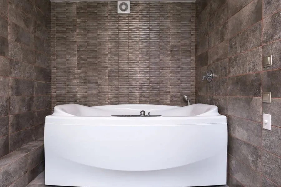 Modern white acrylic bath fitted in a Derby bathroom