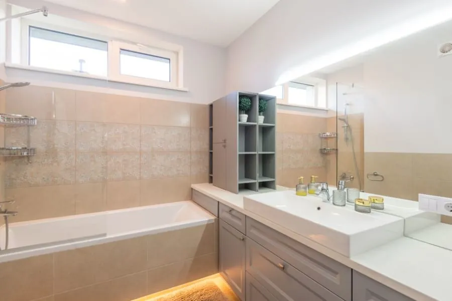 Bathroom layout with a bath under a window in a Derby home