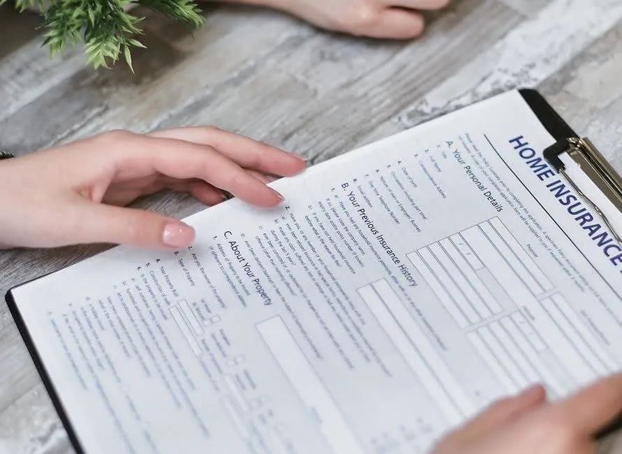 Homeowner reading guarantee and certificate paperwork after a bathroom installation