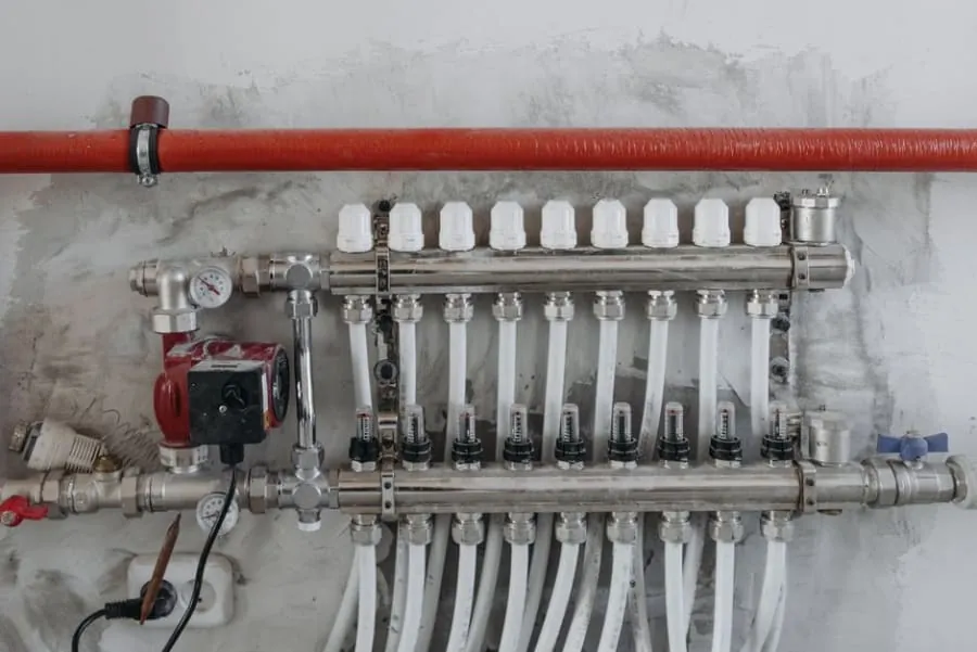Underfloor heating being installed under a bathroom floor