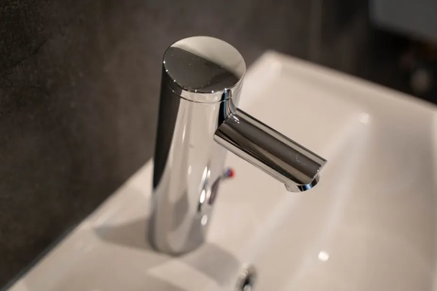 Chrome bathroom mixer tap on a basin
