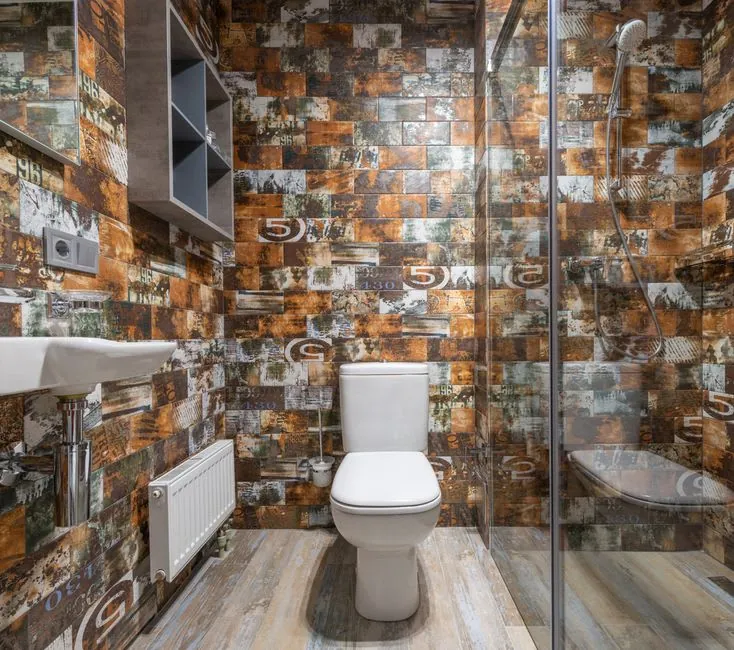 Close-coupled white toilet in a Derby bathroom