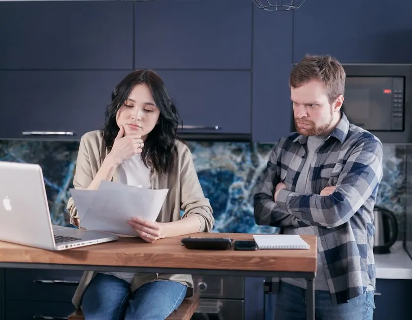 Couple in a Derby home reviewing bathroom renovation finance options together