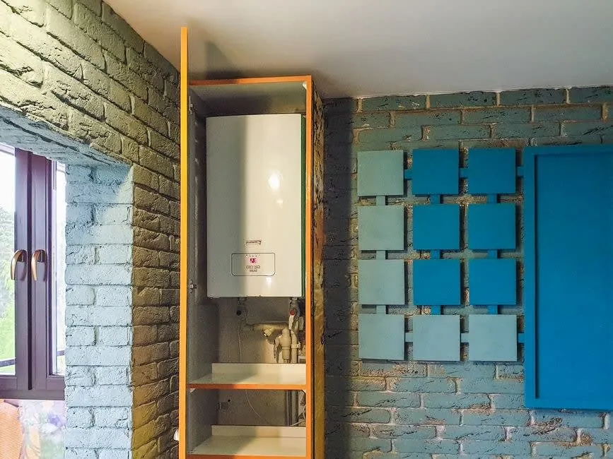 Hot water system and boiler serving a bathroom in a Derby home