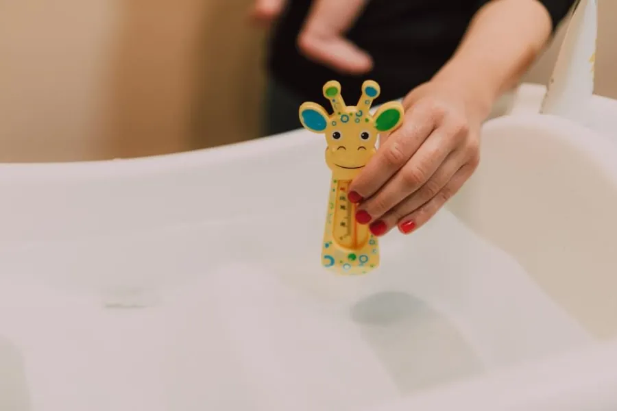 Bath thermometer and child-safe features in a family bathroom