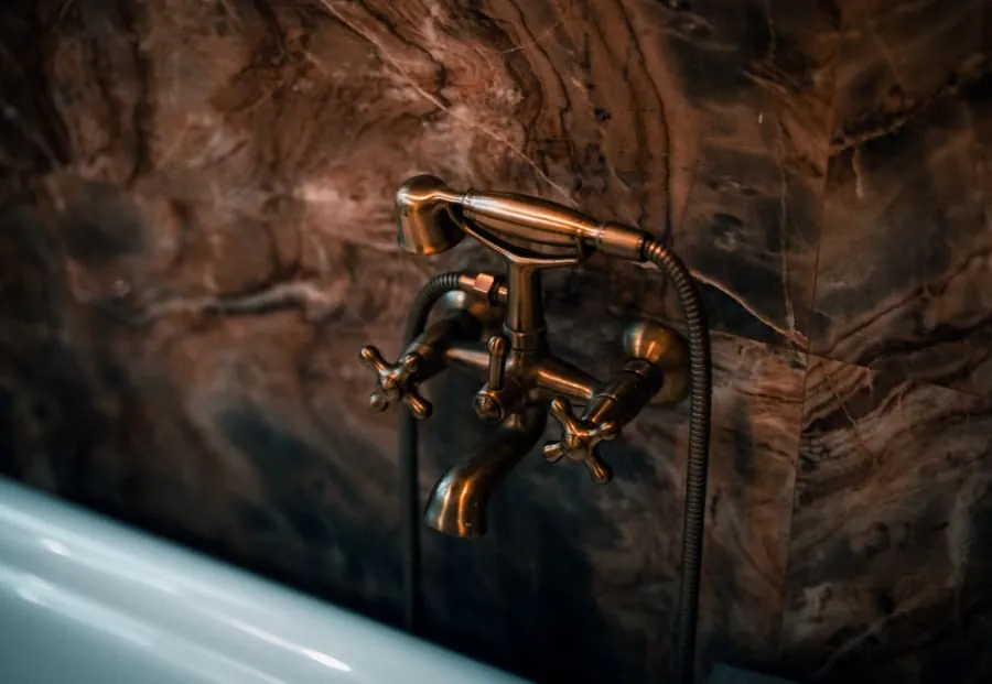 Brushed brass bathroom tap suited to hard-water areas