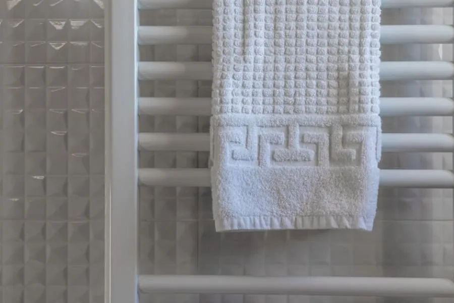 Heated towel rail with towels in a Derby bathroom
