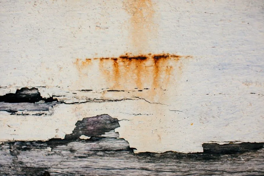Staining and cracked surface caused by long-term water damage