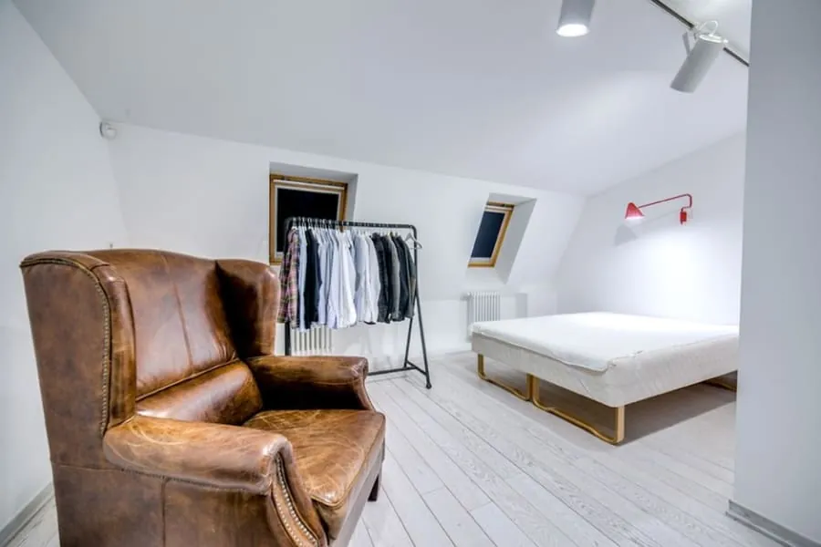 Loft space with a sloping ceiling and skylight suited to an en-suite