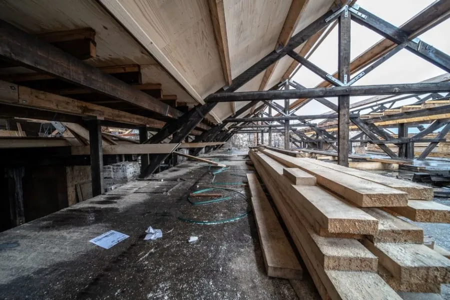 Timber floor structure being strengthened in a loft conversion