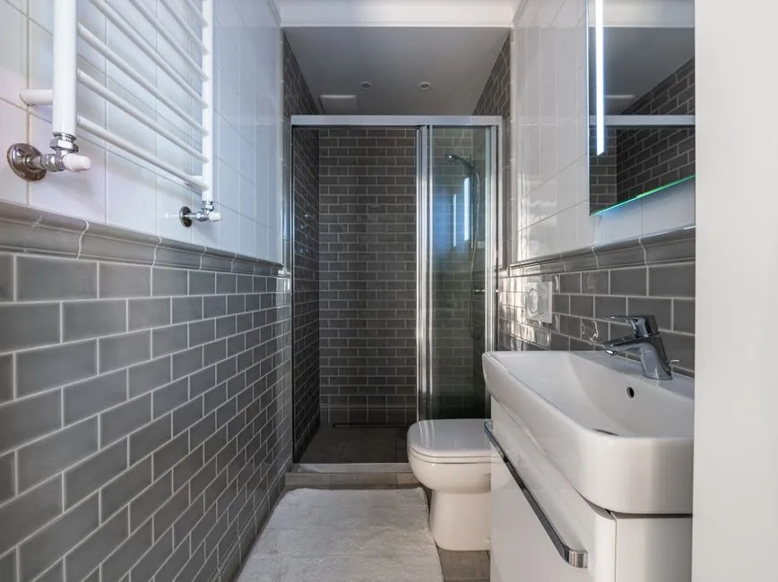 White metro tiles suited to a period Derby bathroom