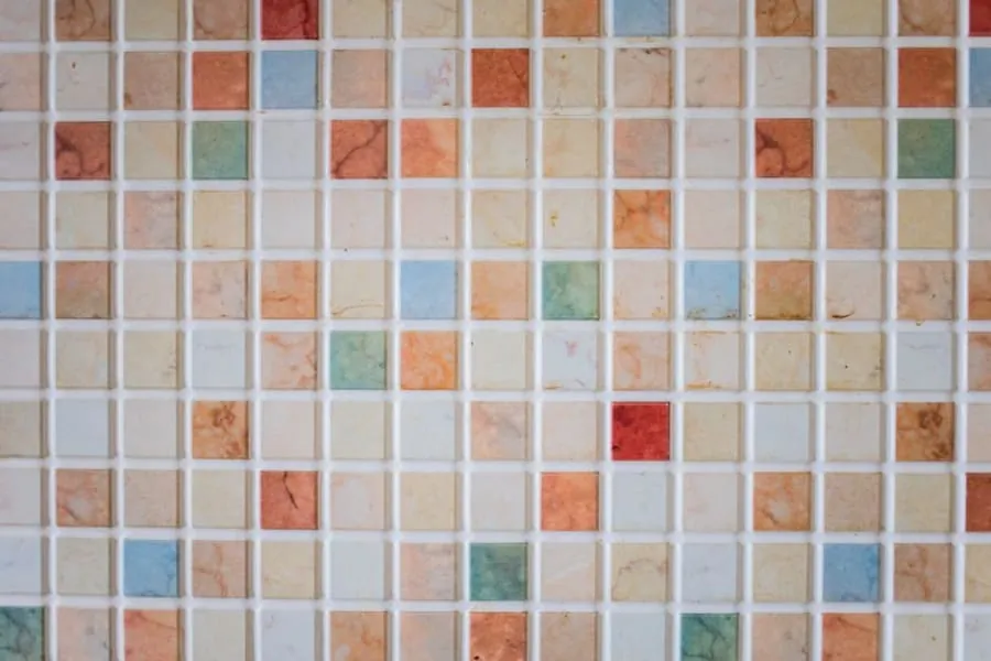 Sealant and tiling detail being checked in a new-build bathroom