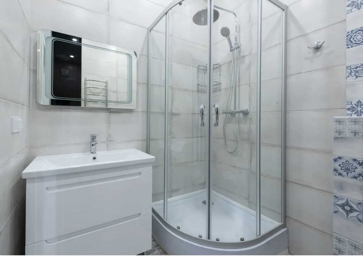 Curved glass shower enclosure in a modern Derby bathroom