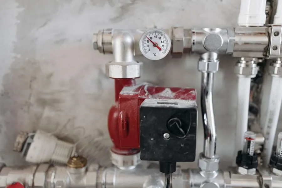 Boiler and plumbing pipework that determines shower pressure