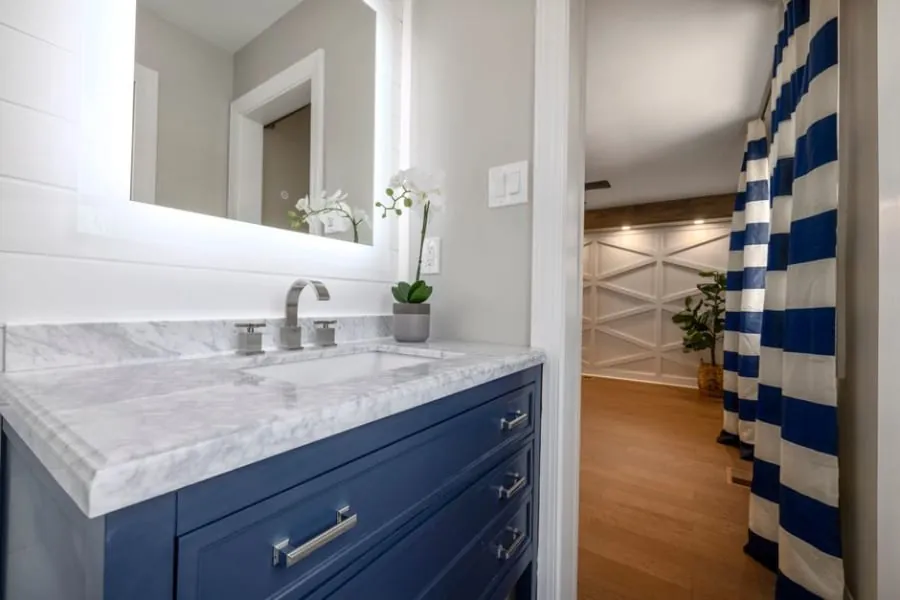 Smart LED mirror and clever storage in a modern bathroom