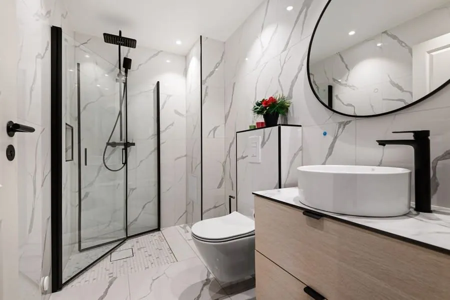 Bathroom suite display in a showroom, comparing supply-only and supply-and-fit options for a Derby renovation